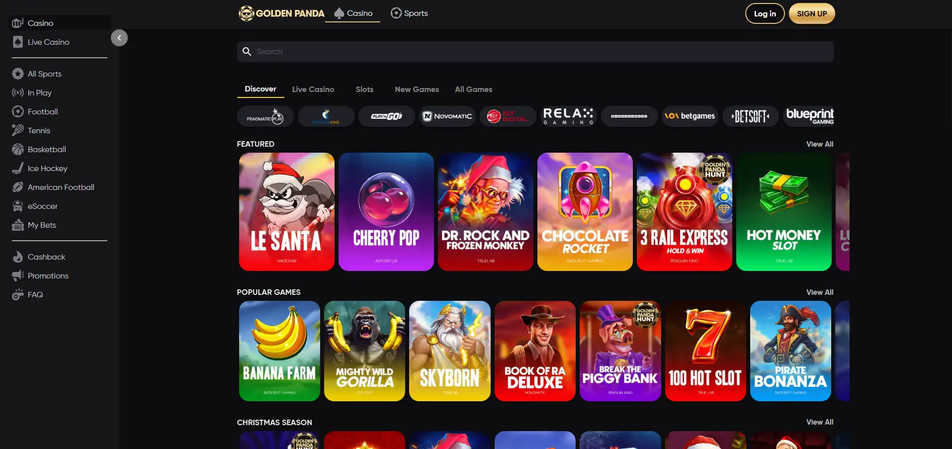 Golden Pandan peliaulan näkymä mustalla taustalla, jossa esillä suositut pelit, jouluiset tarjoukset ja valikkovaihtoehdot.